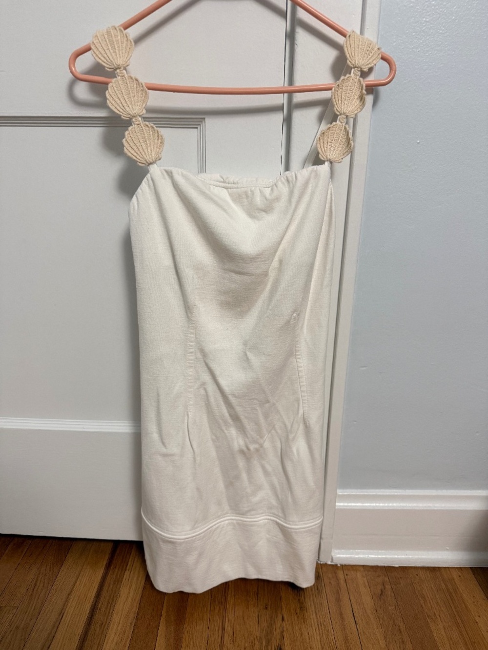 White mini dress with sea shell strap detail